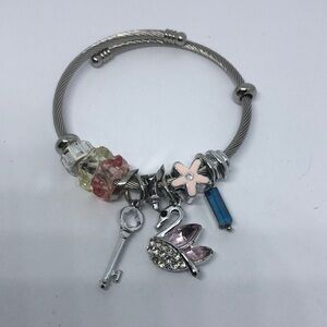 SILVER tone memory coil rope slide and dangle charm bracelet swan key flower.